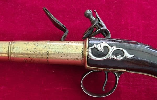 A rare Queen Anne style brass framed Silver mounted Flintlock pistol by HEYLIN LONDON. Ref 4029.